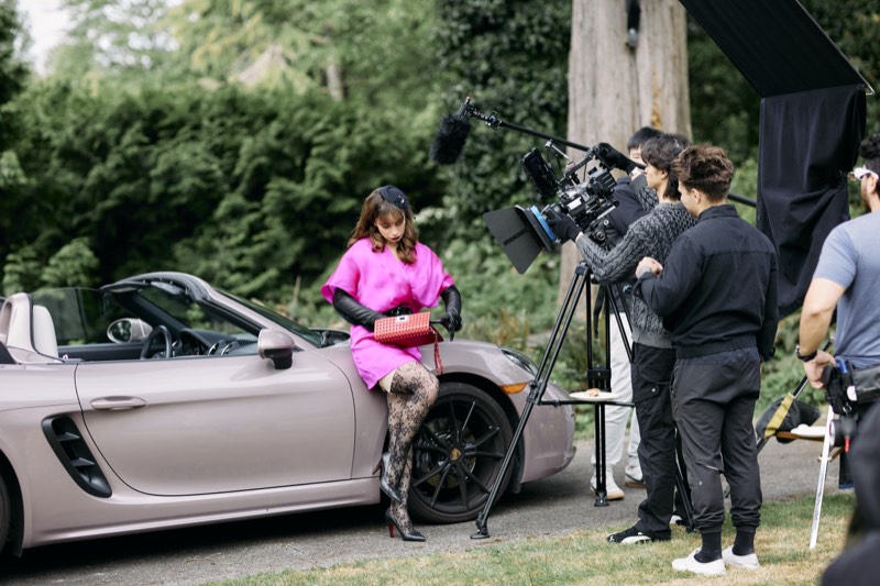 Camera operator and crew filming a scene on location in Vancouver.