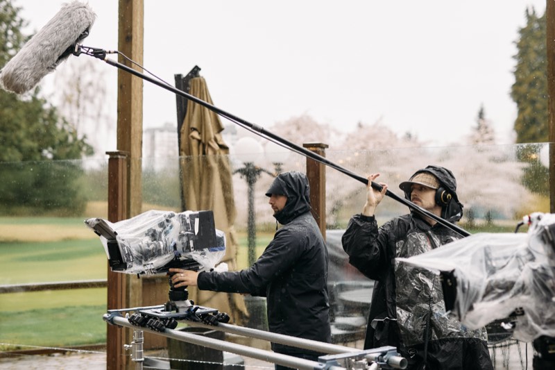 Camera rig and dolly track laid out on a production set.