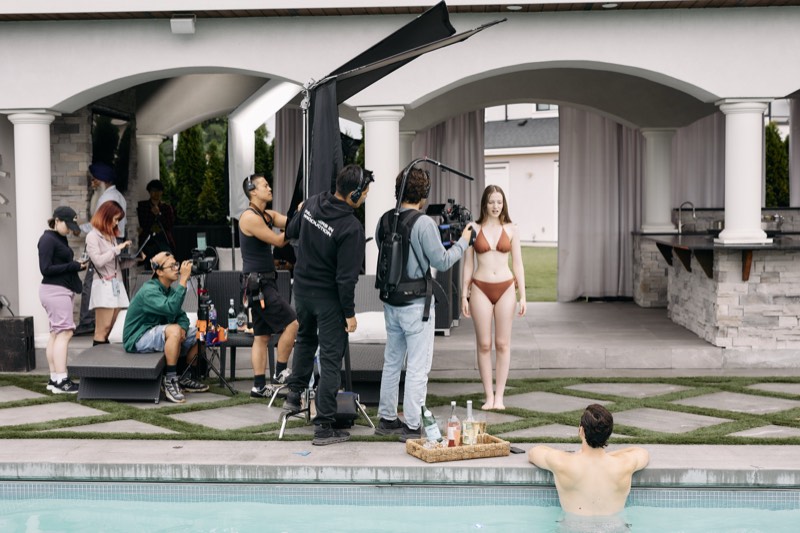 Behind-the-scenes view of a lit interior set during filming.