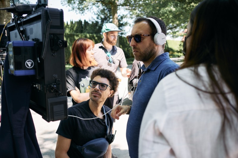 Director and crew watching a take on the monitor at video village.