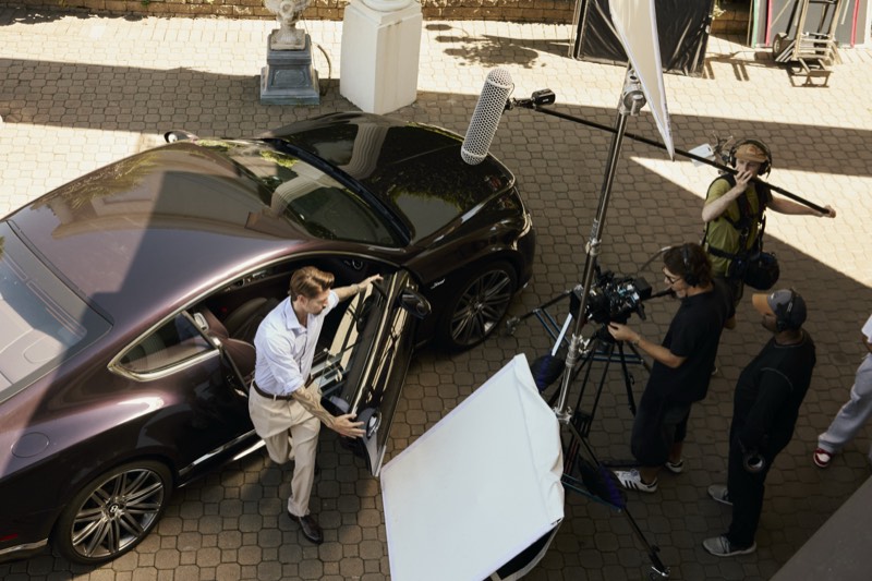 Camera rig and dolly track laid out on a production set.