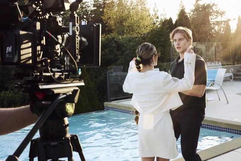 Actors running a scene while the crew works around them.