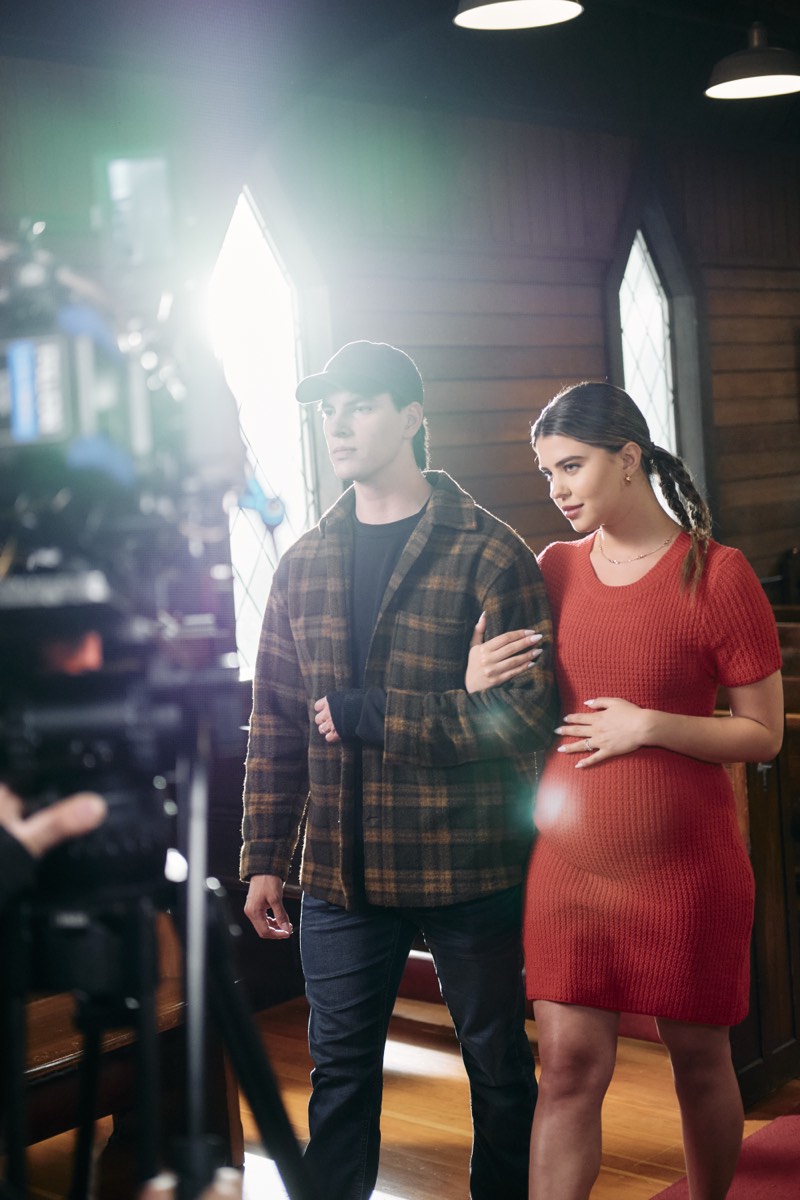 Camera operator and crew filming a scene on location in Vancouver.