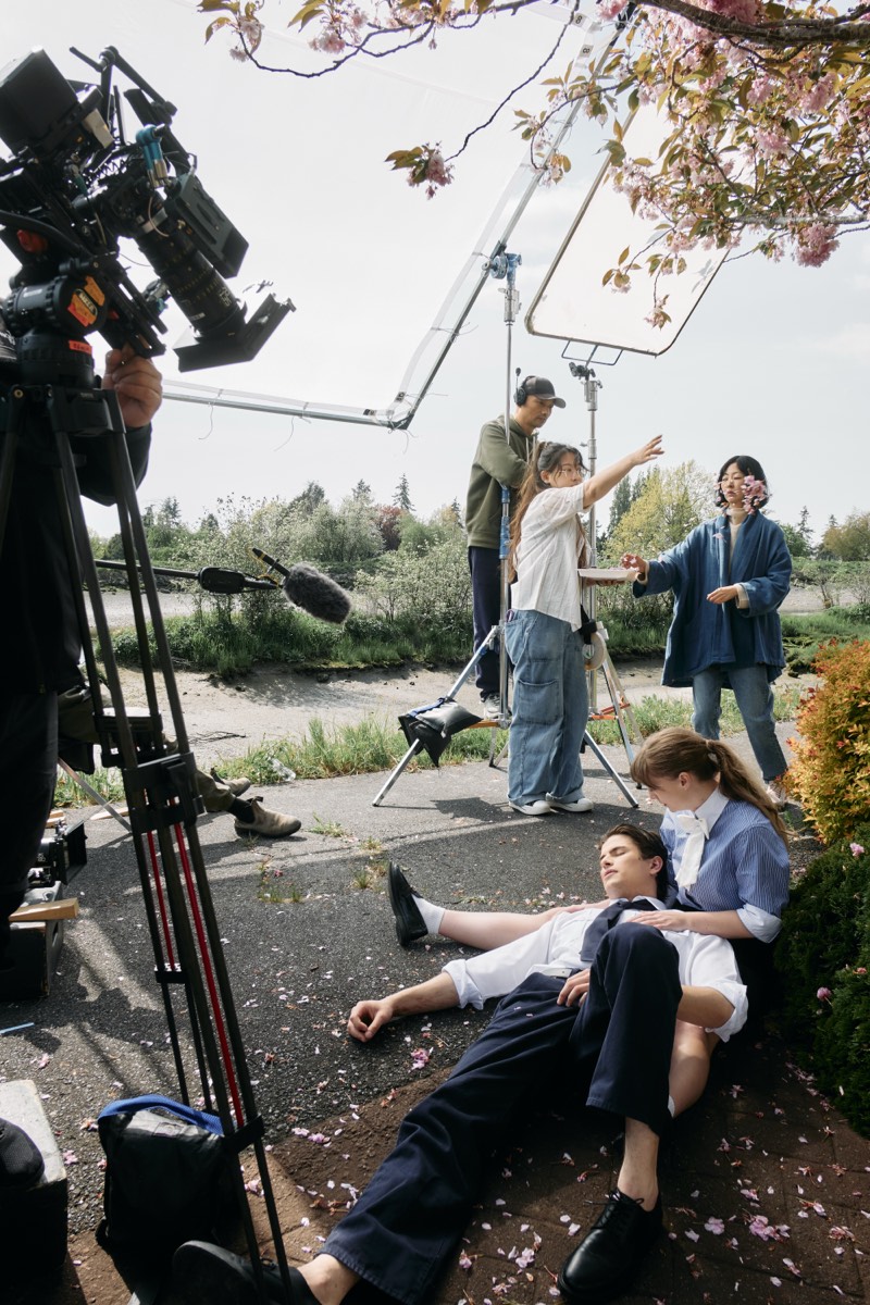 Actors running a scene while the crew works around them.