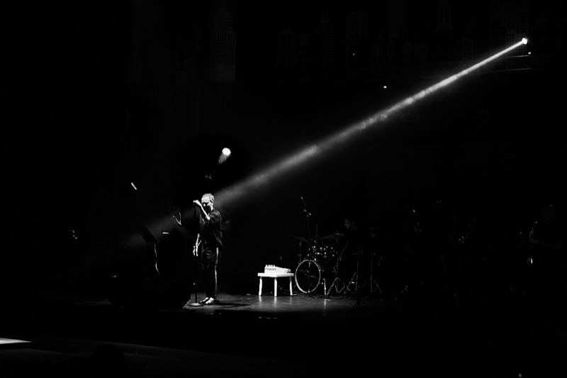 Performers on stage during a large ceremonial event.