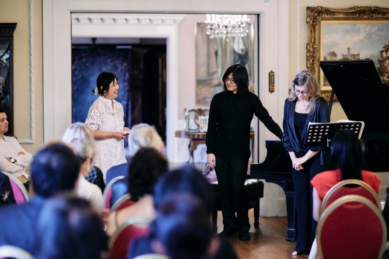 Guests toasting with champagne during a celebration.
