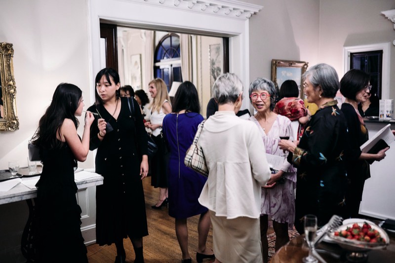 Guests dancing at an evening celebration.