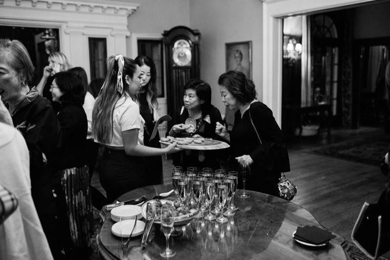 String ensemble performing for seated guests at a private event.