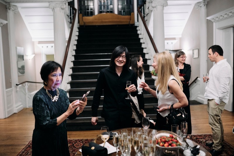 Guests toasting with champagne during a celebration.