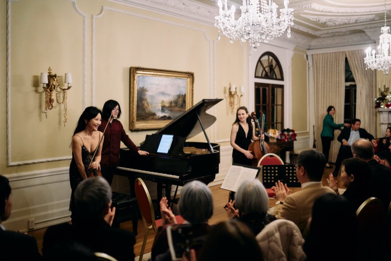 Live music performance at a corporate event, photographed candidly.
