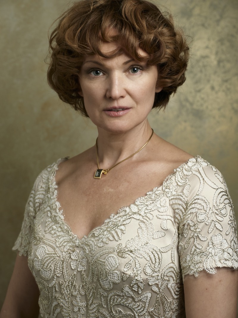 Studio headshot of a woman against a softly textured backdrop, photographed in Vancouver.