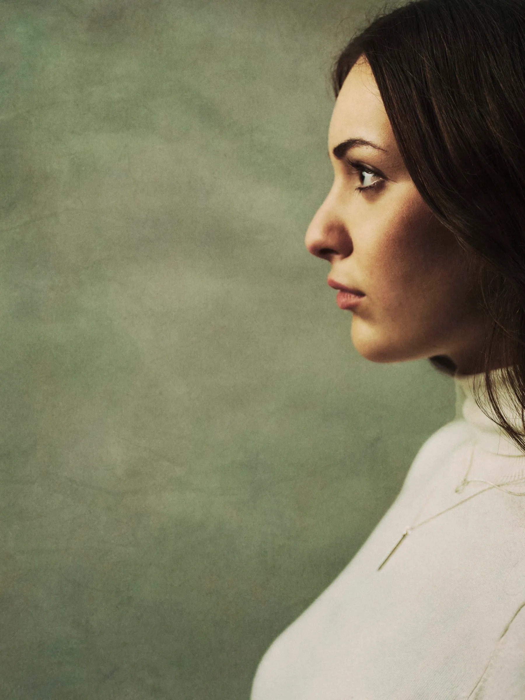 Studio portrait lit against a plain backdrop, photographed in Vancouver.