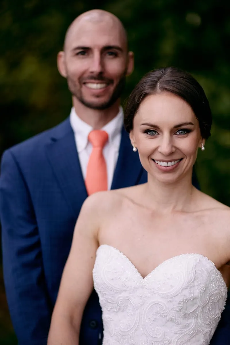 Olivia and James together, smiling at the camera.