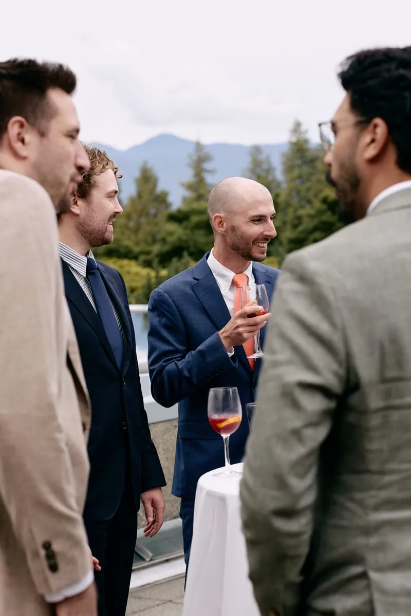 James with friends, a drink in hand.