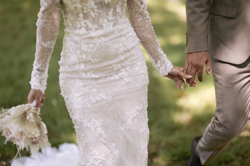 Detail of a veil and gown catching the light.