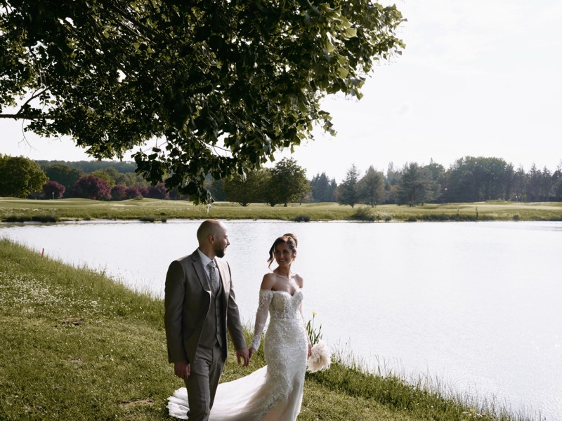 Bride and groom together at a formal chateau venue.